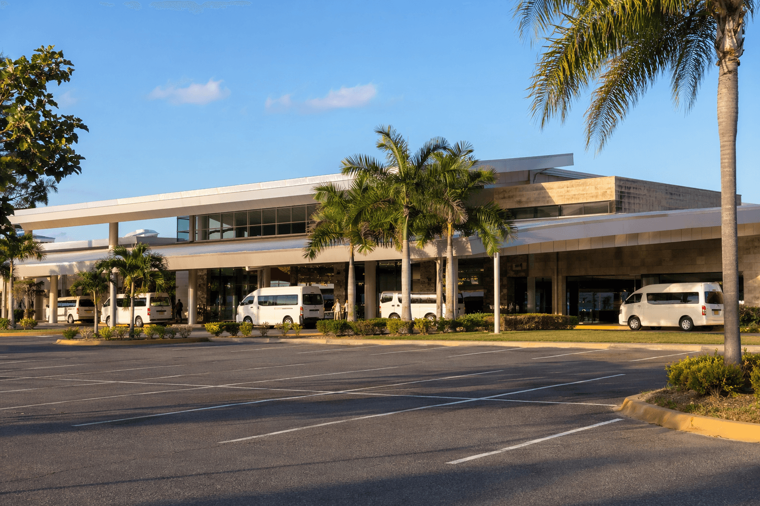 Liberia Airport exterior with shuttle vans — Guanacaste, Costa Rica