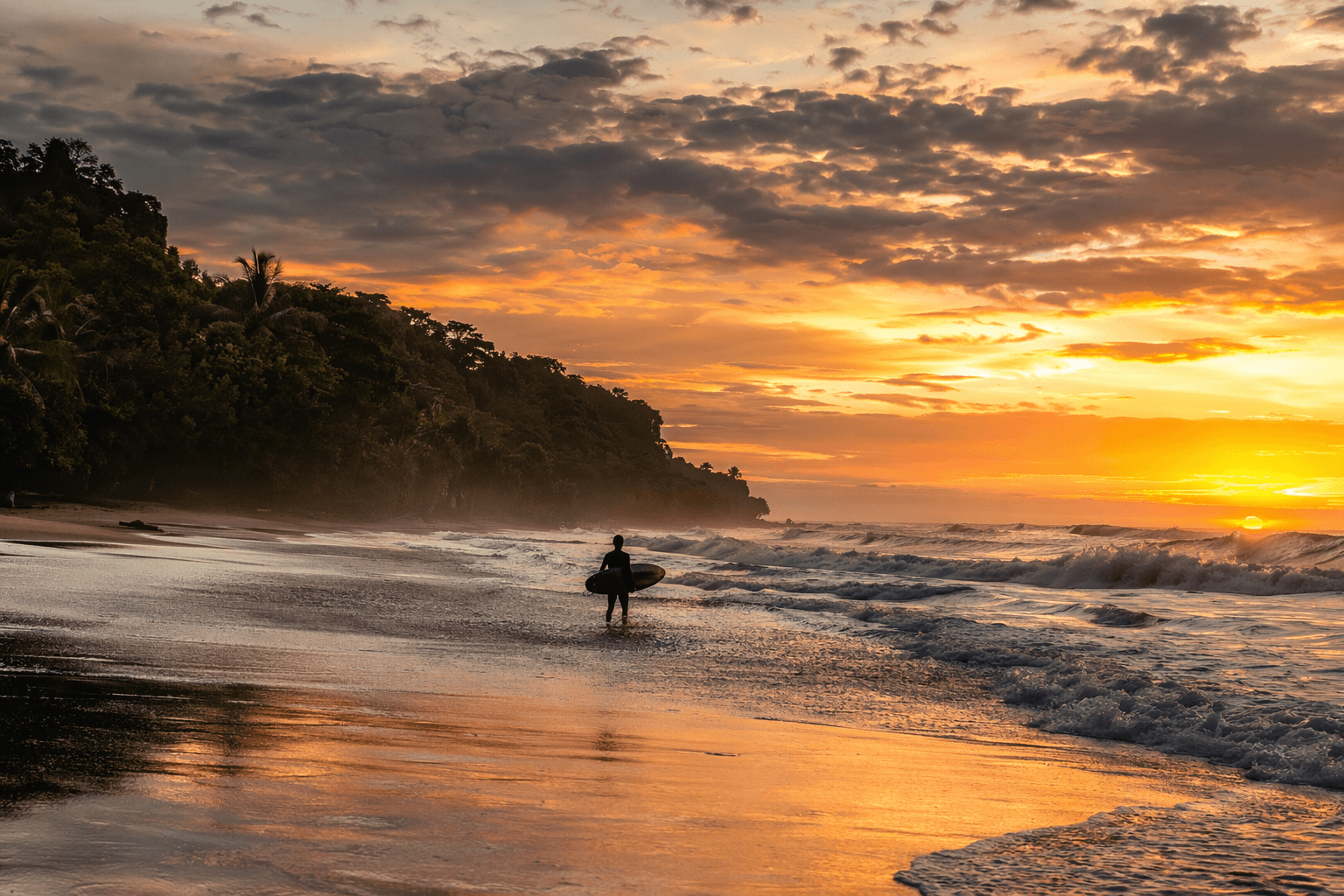 Playa Guiones Nosara at sunset with surfer silhouette
